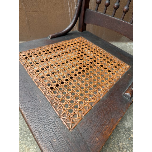 Early 20th/Late 19th Century Victorian Rocking Chair With Spindle Back and Cane Seat For Sale - Image 9 of 12