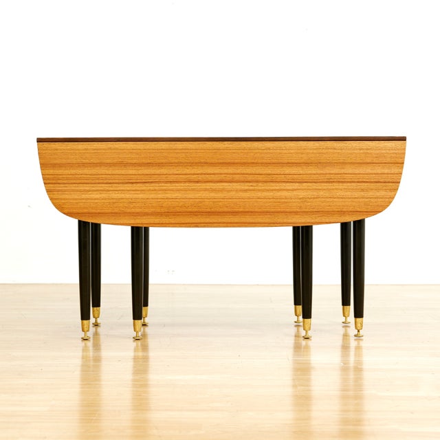 This beautiful vintage drop leaf table was produced by E Gomme (G Plan) as part of their 'Librenza' range in 1959. A...