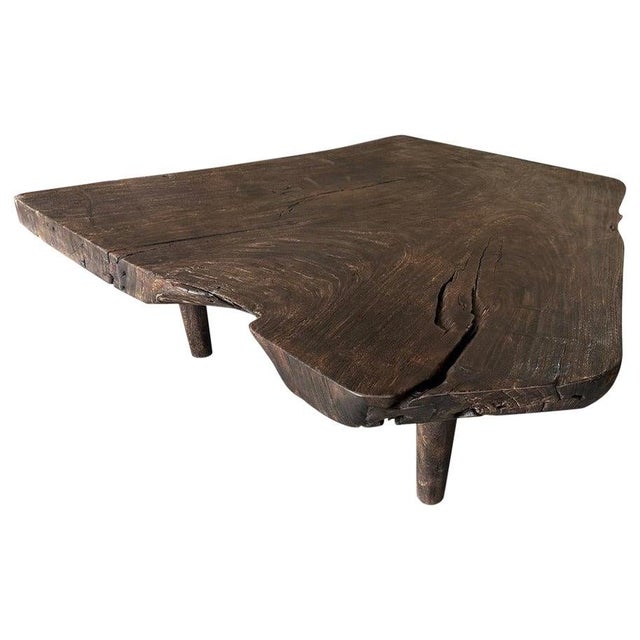 Beautiful live edge coffee table produced from a single three inch thick suar wood slab. Charred one time revealing the...