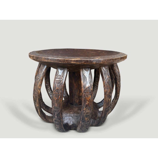 "Beautiful hand carved side table from West Africa hand made from a single piece of wood. This over sized vintage piece...