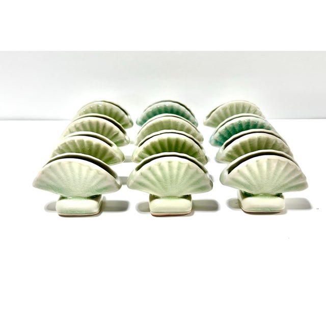 A wonderful set of seaside placecard holders. Perfect for the beach or lake house. The colors vary between green and blue....