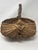 This exceptional antique buttocks basket (also known as a melon or egg basket) is a masterclass in American primitive folk...