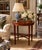 A beautifully proportioned circa 1930s–40s mahogany side table with an elegant oval top, subtly raised edge, and slender...