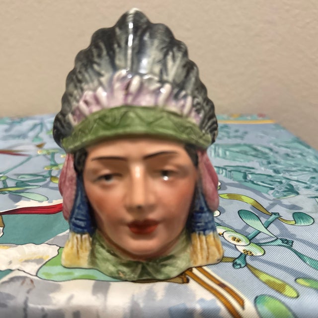 An exceptional example of turn-of-the-century Continental figural tobacciana. This antique majolica tobacco jar features a...