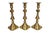 A set of three traditional brass candlestick holders made in the USA by Baldwin Brass. Turned with beehive shaped columns...