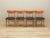 The set of four chairs was made in the 1970s, Danish production. The structure is made of solid oak wood, the back is made...