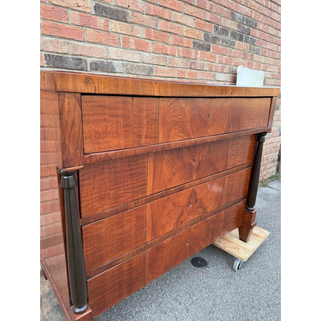 Exquisite Biedermeier Walnut Dresser from 1820, Southern Germany. This remarkable Biedermeier chest of drawers, dating...