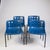 Robin Day Polo Chairs are a set of four royal blue mid-century dining chairs designed to bring classic British style and...