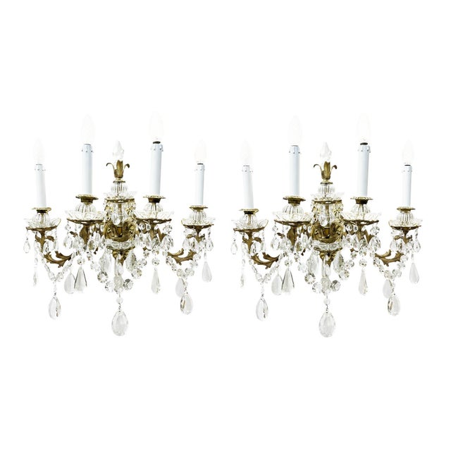 Pair of four-light crystal and bronze wall lamps from the early 1900s, completely restored by our workshop. A pair of...