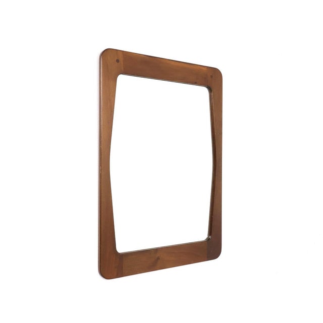 Vintage wooden wall mirror designed by Aksel Kjersgaard for Illums Bolighus, Copenhagen, 1960s. The mirror has an organic...