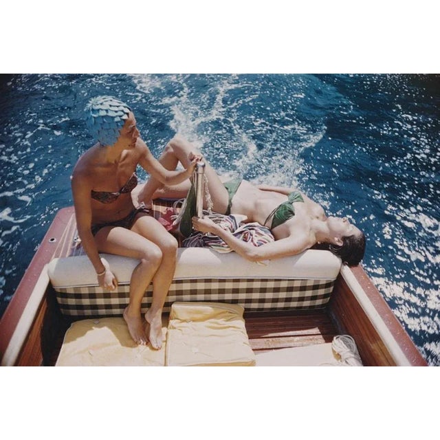 Vuccino And Rava 1958 by Slim Aarons Slim Aarons Limited Estate Edition Carla Vuccino, wearing a swimming cap, and a...