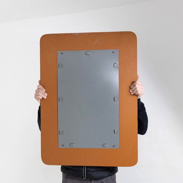 Mirror with a stained glass frame, a clean rectangular shape with rounded corners. Small oxidation on the mirrored part....