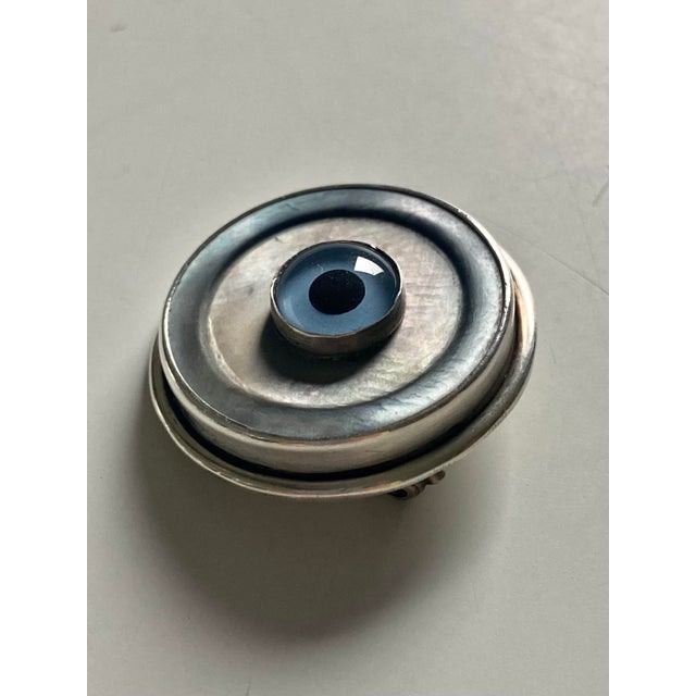 Contemporary Sterling Silver Evil Eye Brooch Pin Amulet Wood Display Pedestal (Cabinet of Curiosities) For Sale - Image 3 of 11