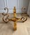 Spectacular matched pair of heavy, handcrafted wrought iron table bases featuring bold scrollwork and an original antiqued...