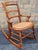 A classic Victorian stained Walnut and Cane Seat Rocker Measures 18.5" in width, 29.5" in depth and 29" in height. Seat...