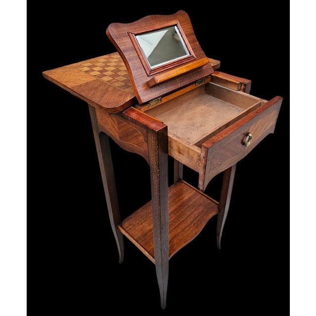 This early 19th-century Louis XVI French Marquetry Ladies Game, Desk, and Dressing Table is a unique piece that combines...