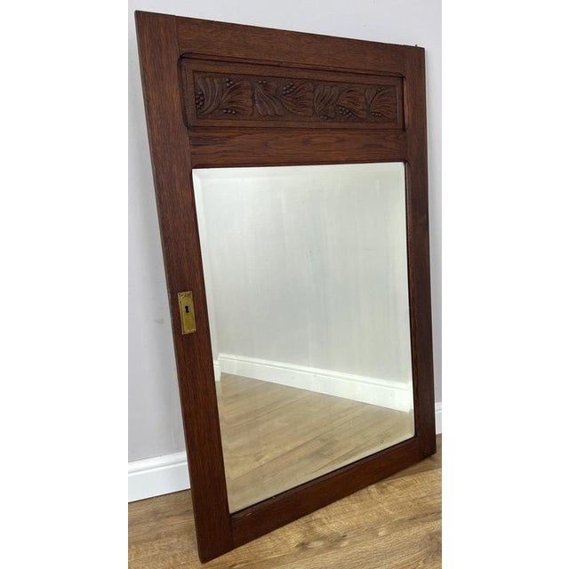 This elegant Antique French mirror , originally part of a wardrobe, showcases a beautifully crafted oak frame with an...