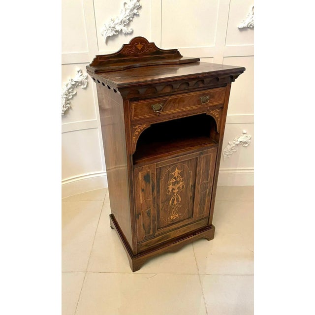Antique edwardian quality rosewood inlaid side cabinet having a quality rosewood top with a shaped rosewood inlaid back...