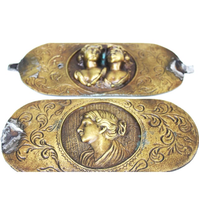 Set of four antique Italian bronze decorative plaques featuring classical neoclassical medallion motifs. The plaques...