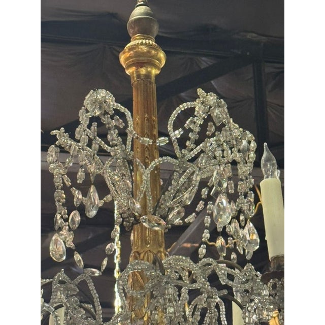 This product is a 19th century Italian giltwood and crystal chandelier from Genoa. This chandelier features a lovely...