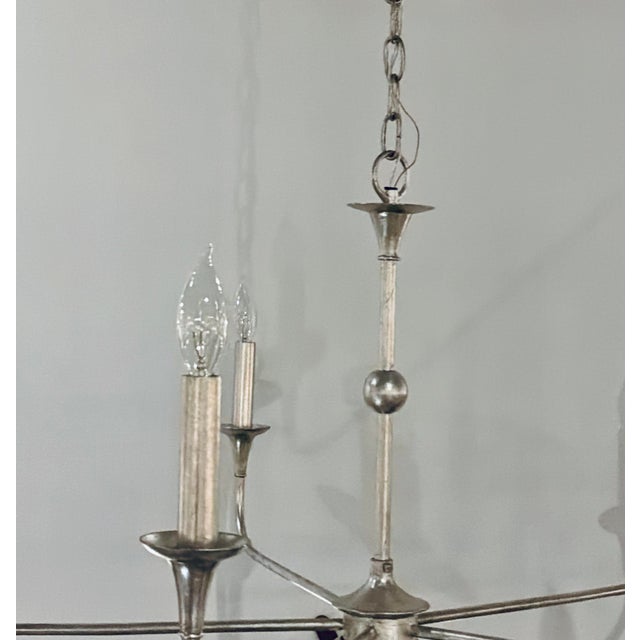 Original retail $1490, stylish Currey & Company Modern Silver Finished Nottaway Chandelier, showroom floor sample