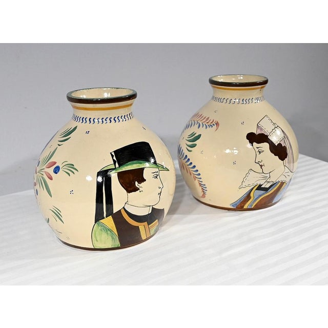 Pair of polychrome earthenware ball vases from the Henriot de Quimper manufacture, created under the reign of Louis XIV in...