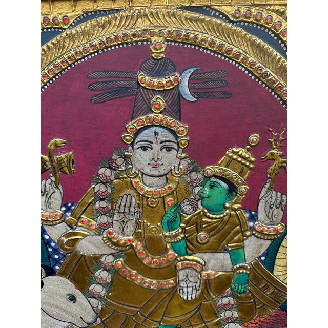 Antique Tanjore painting depicting Pradosha Moorthy Shiva with Parvati riding Nandi. South India. Mid 20th century,...