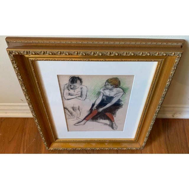 Framed print of Edgar Degas's "Dancer with red Stockings", a pastel drawing from around 1884. The artwork captures a...