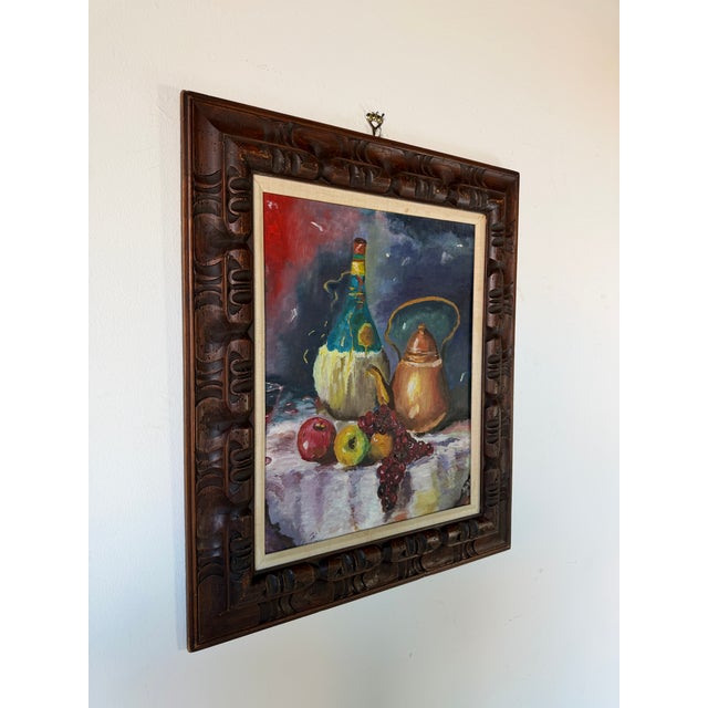 Charming 1960s Mid-Century still life oil painting featuring a wine bottle, apples, and grapes. Painted with expressive of...