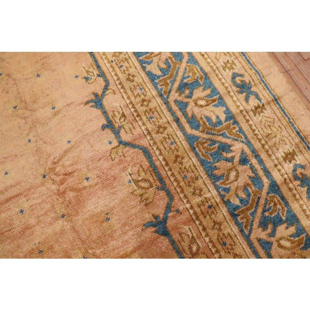 An enormous antique Turkish Oushak rug with a very interesting turquoise shade with a caramel center medallion set on a...