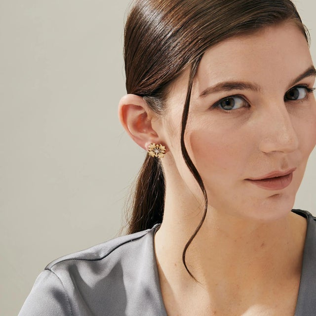 Created in 18 karat yellow gold Diamonds 0.20 carat approx. 18kyg butterfly backs Glisten and shine with these luxurious...