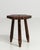 A 19th century French stool featuring a three-legged construction with carved wooden details. The form is compact, with a...