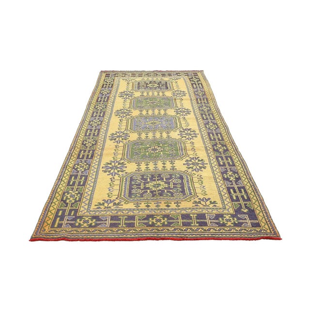 Handknotted vintage wool rug from Oushak region of Turkey. Approximatelly 50-60 years old. In very good condition.