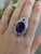 This striking ring features a large 20x15mm oval amethyst, set in solid 14K white gold and accented with natural, earth-...