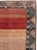 This mid-20th-century Turkish Anatolian wide gallery runner presents an expansive open field in layered tones of coral,...