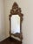 An exceptional late 19th century Italian giltwood mirror with richly carved Rococo detailing and a beautifully aged...