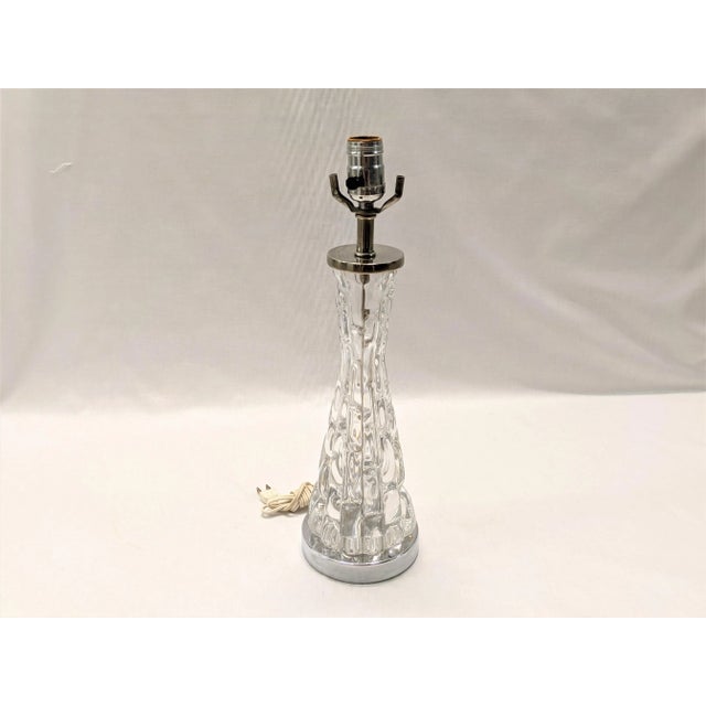 A vintage Orrefors crystal table lamp designed by Carl Fagerlund (model RD1477). Combining art and function, this...