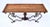 An impressive studio forged iron console table with solid Oak breadboard top, turned inlay vase shape center, distinctly...