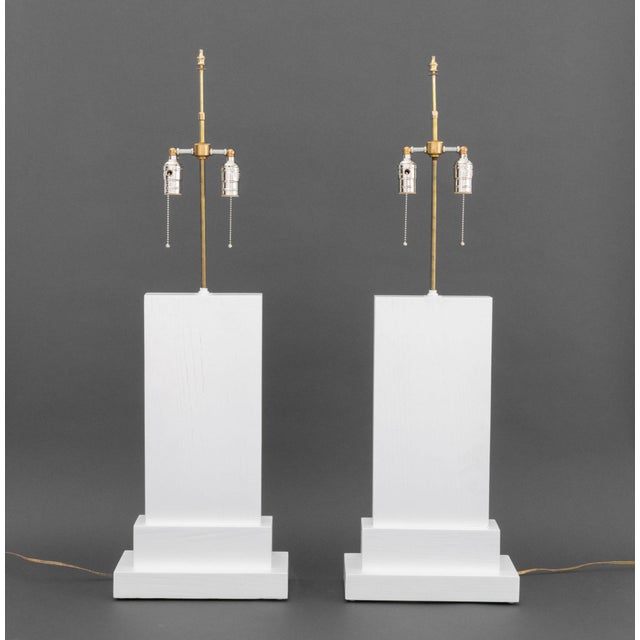 Pair of Minimalist White Painted Wood Table Lamps, each rectangular with stepped bases and two bulb fittings. Slightly...