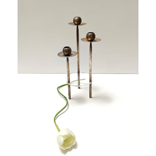 Made in Italy, 1970s. This splendid candelabrum is made in silver-plated brass and acrylic glass. It features its original...