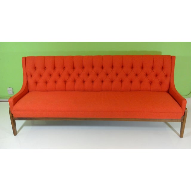 This is an uncommon narrow sofa circa 1970. All restored as original. Walnut base frame and tufted upholstery. Seat height...