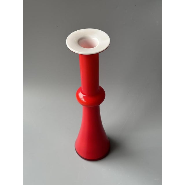 Elegant soliflore vase in blown glass, produced by the Danish manufacturer Kastrup Holmegaard in the 1960s. This model...