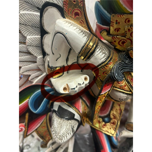 A striking, large-scale hand-carved Garuda sculpture, richly painted and gilt in the traditional Balinese style. Garuda —...