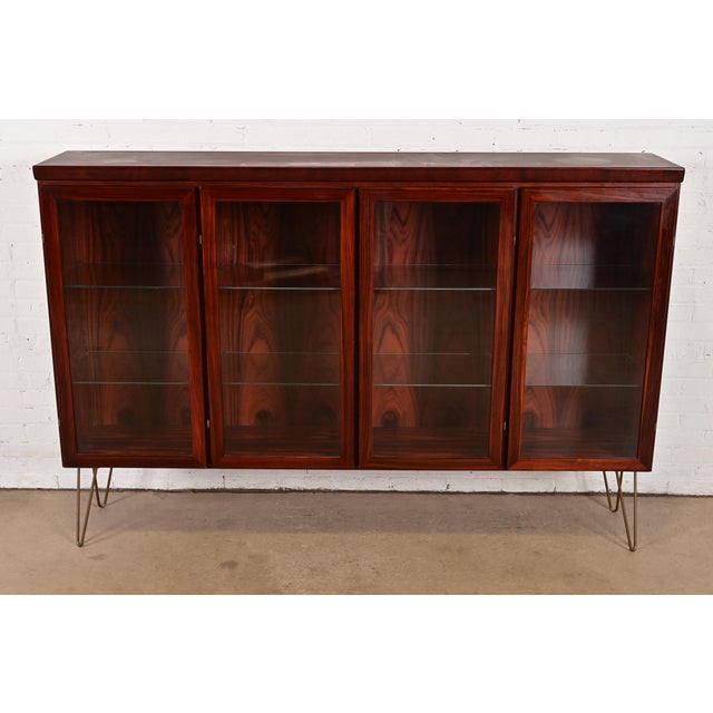 A sleek and stylish mid-century Danish Modern lighted bookcase or display cabinet By Skovby Møbelfabrik Denmark, Circa...