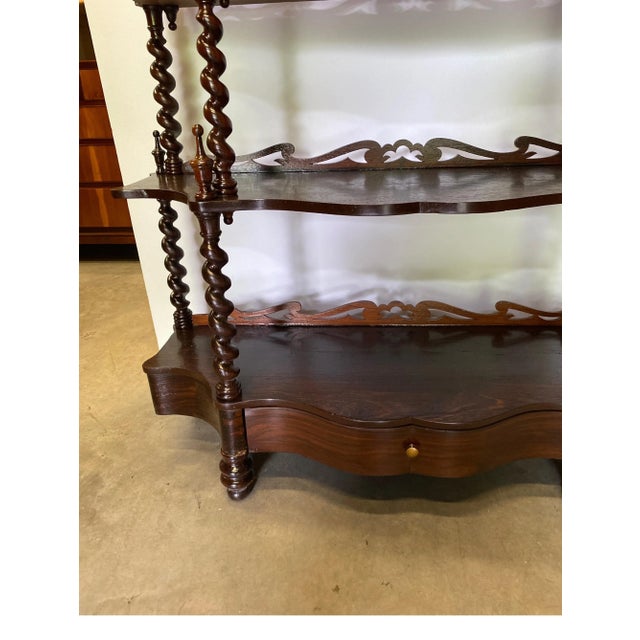 Handsome dark walnut barley twist open book case. The six shelves of variegated sizes with a functional brawer at the...