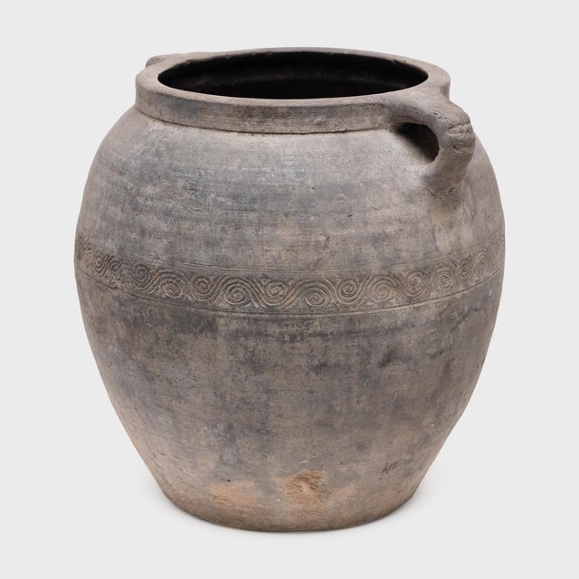 Charged with the humble task of storing dry goods, this antique Chinese jar was potted in the mid-19th century with...