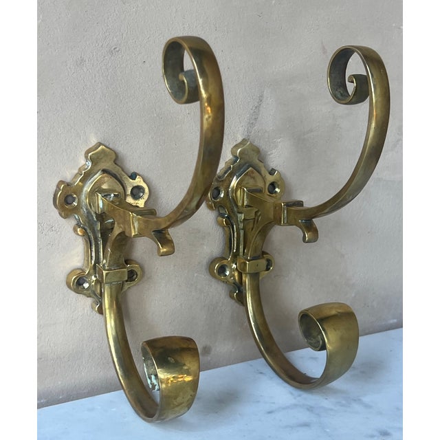 French brass wall hanging for a coat and hat, the set of two was made around the 1930's.