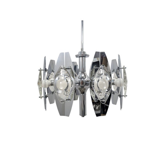 Stunning chrome chandelier by the famous Italian designer Oscar Torlasco. The high quality chrome finish offers a stunning...