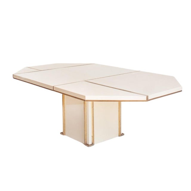 Extendable dining table, Jean-Claude Mahey, lacquered wood and gold brass, 1970s – France This exquisite table clearly...