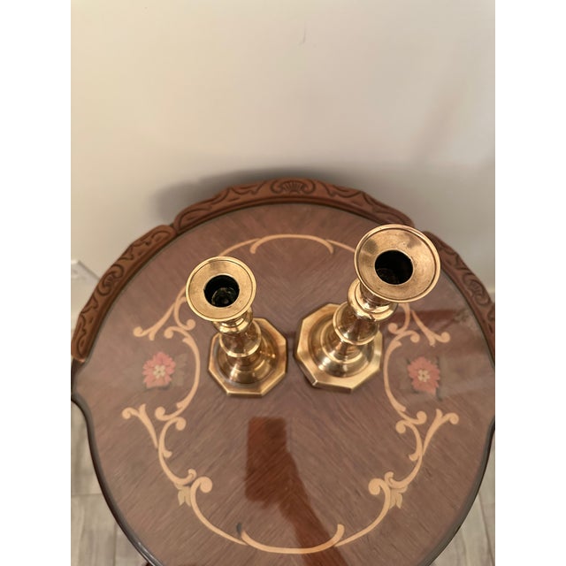 Crafted from solid brass with a warm gold patina. These candle holders include an internal push-up ejector rod mechanism...